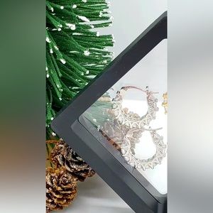 Exquisite Zircon Hoop Earrings..brand new. Beautiful. Silver in color.